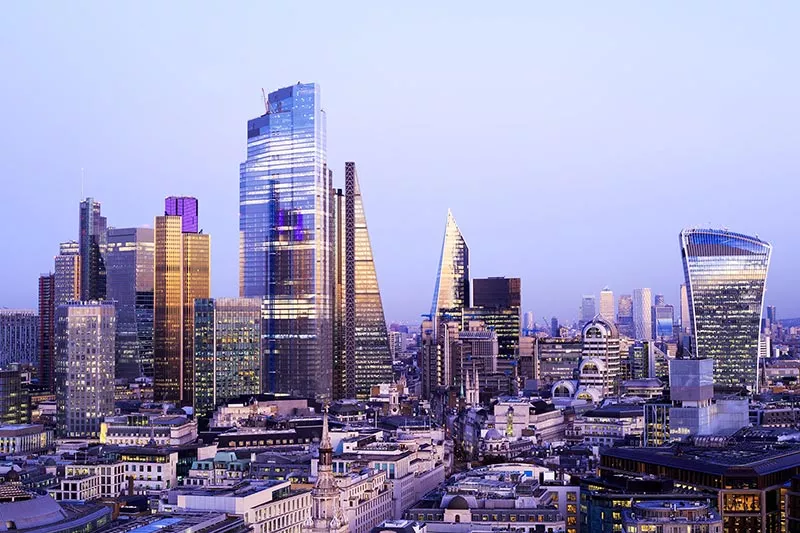 Aerial view over London city skyline at dusk
